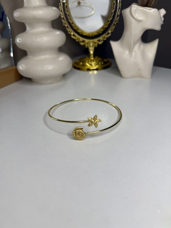Arm cuff coquillage